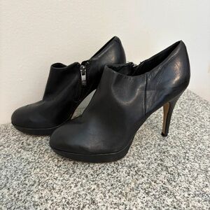 Sleek Black Leather Heeled Boots